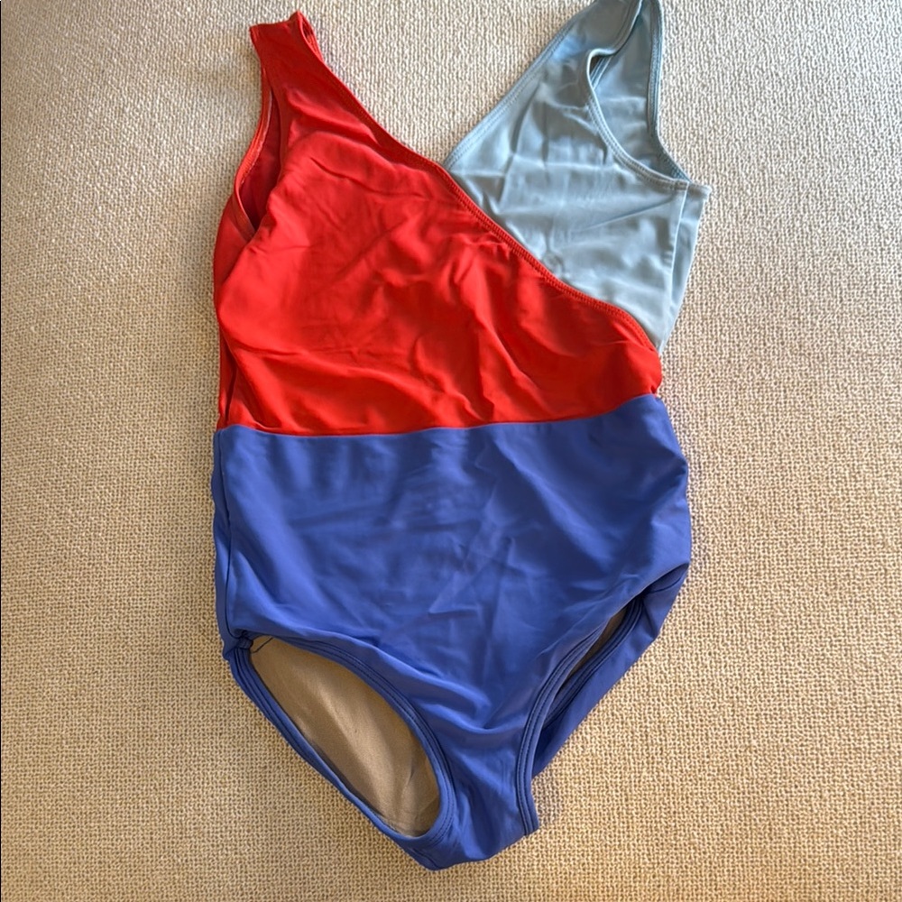 Bold Red and Blue Color-Block Leo with Geometric Design